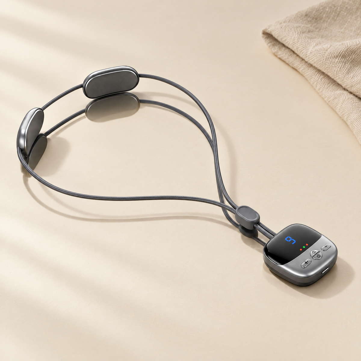 Mini heated neck massager on cream background