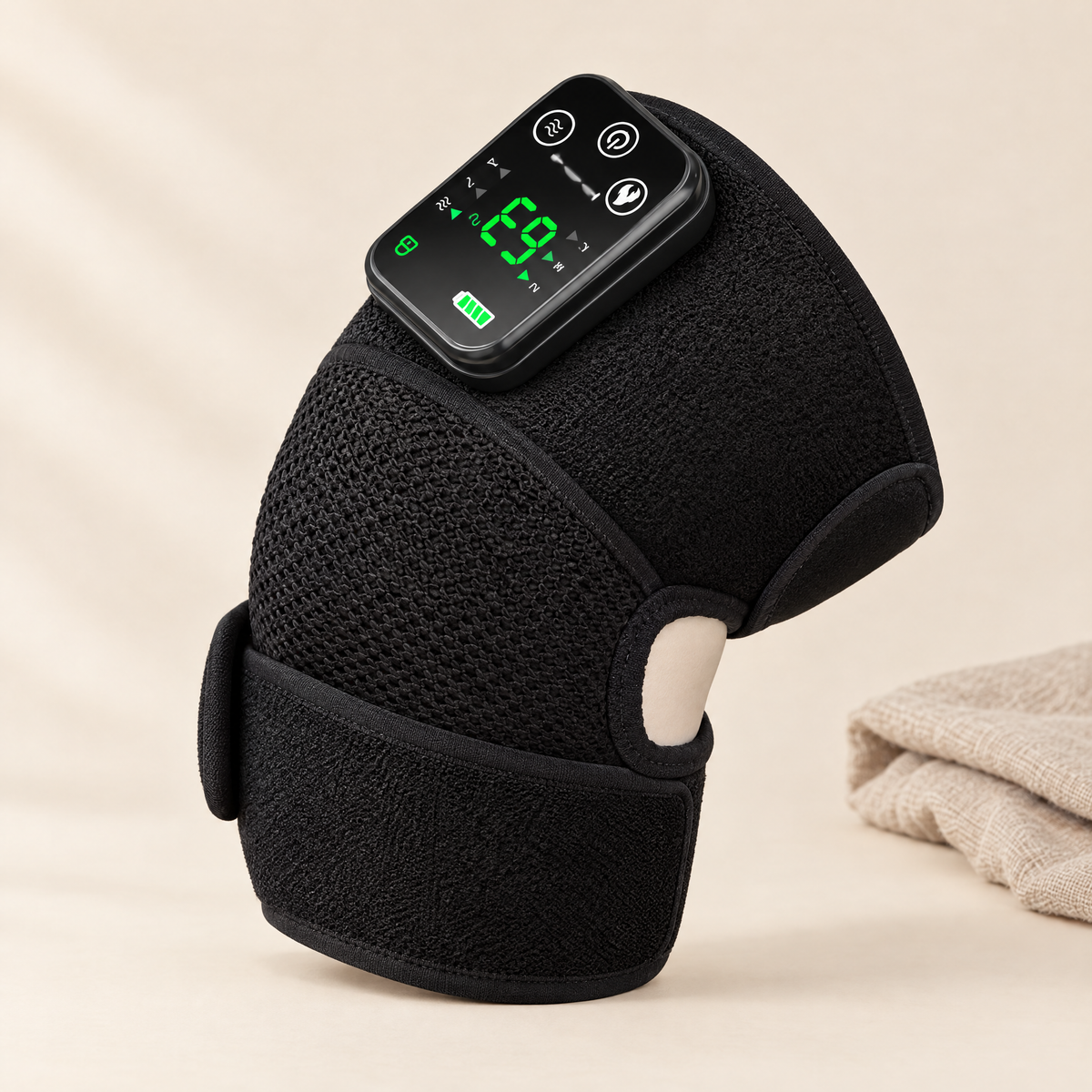 Heated knee and shoulder massager on cream background