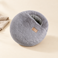 Plush heated foot warmer on cream background