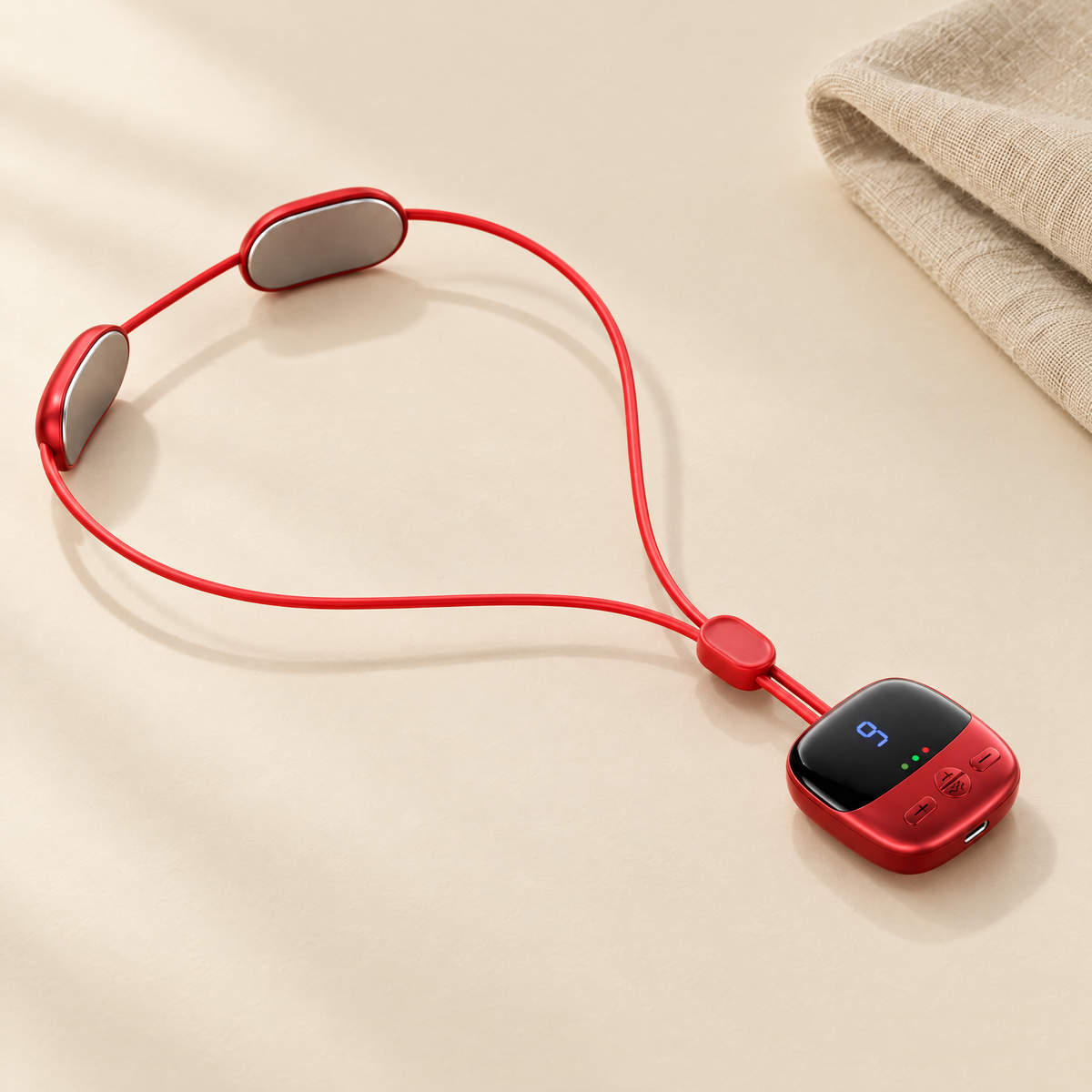Mini heated neck massager in red on cream background